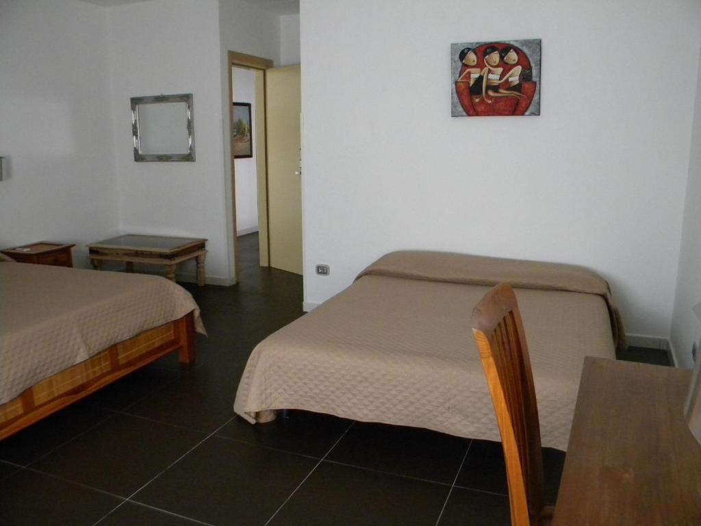 Katil atau katil-katil dalam bilik di HOTEL GENOVA