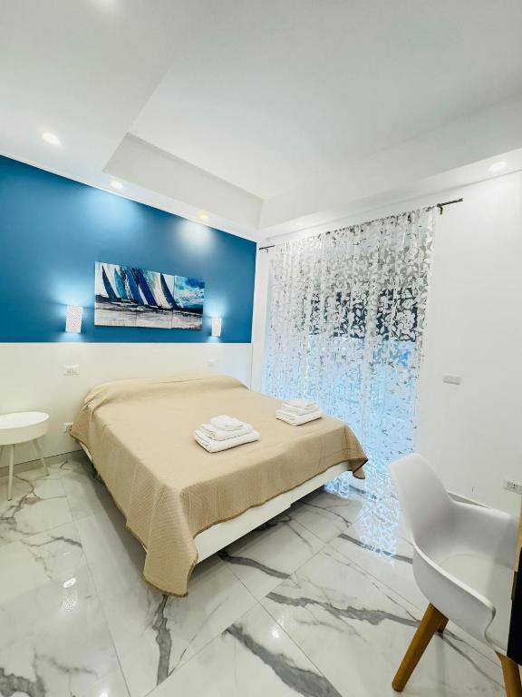 Postel nebo postele na pokoji v ubytování Limoni Inn Messina