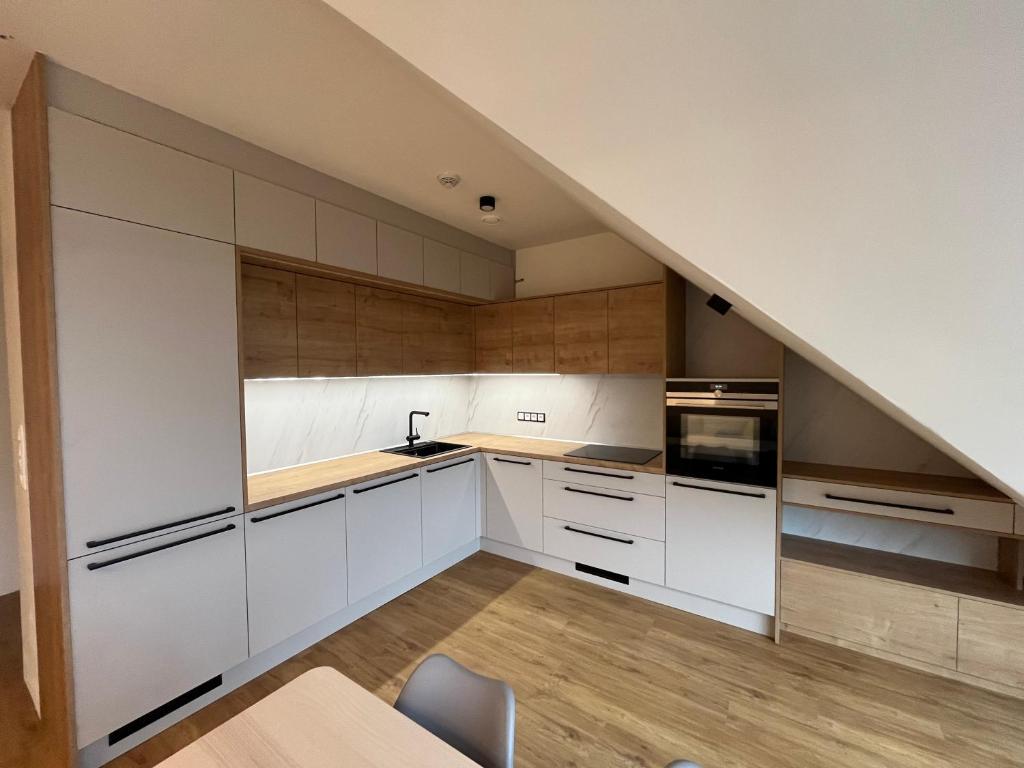 Kuchyň nebo kuchyňský kout v ubytování Fresh Apartments
