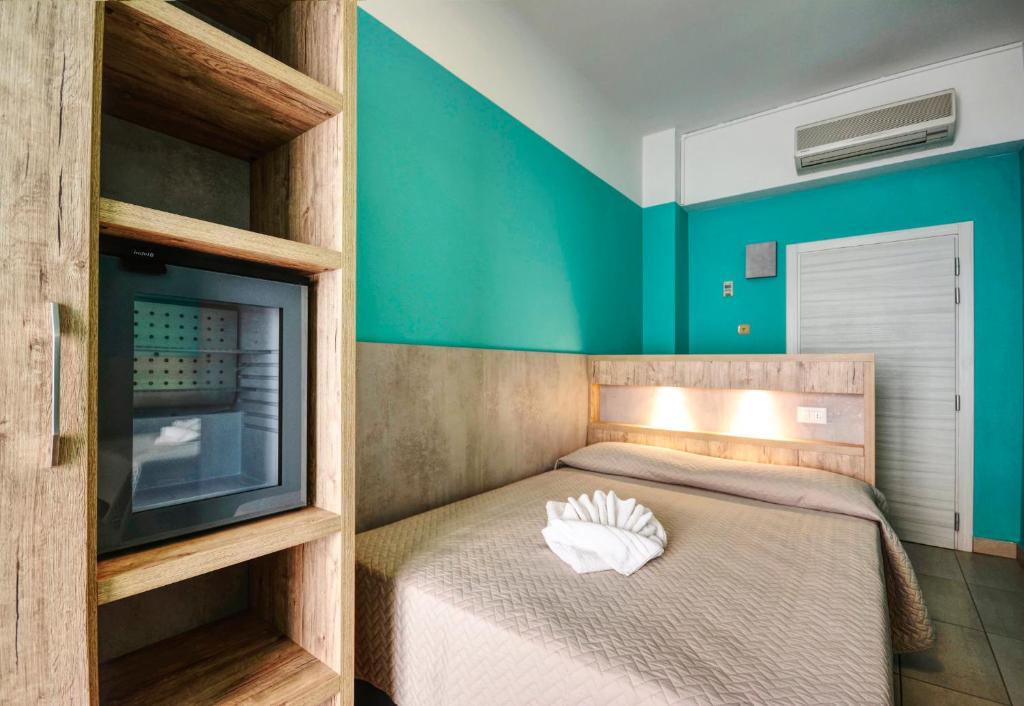 Postel nebo postele na pokoji v ubytování Hotel Alba D'Oro