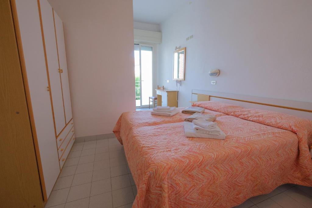 Postel nebo postele na pokoji v ubytování Hotel Alba D'Oro