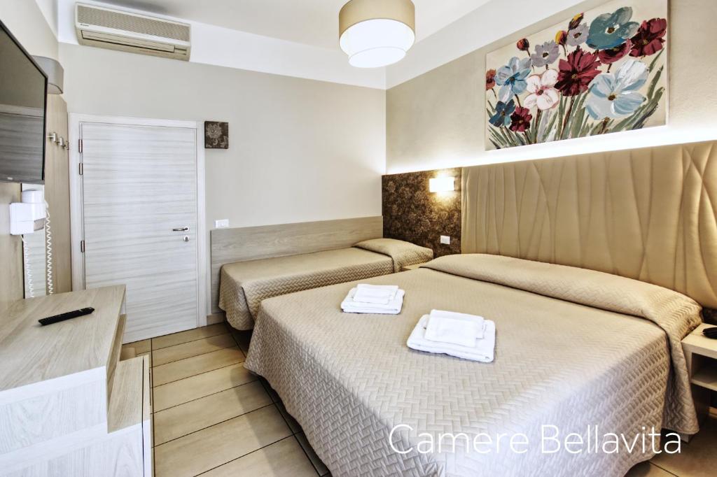 Postel nebo postele na pokoji v ubytování Hotel Alba D'Oro