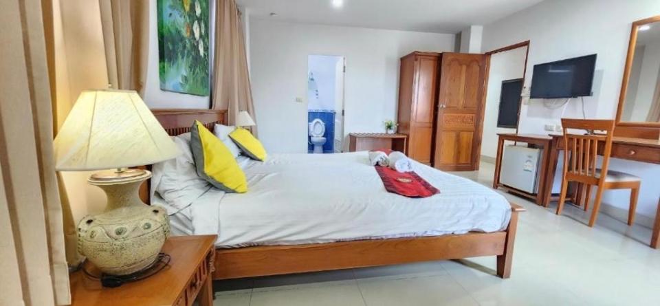 Postel nebo postele na pokoji v ubytování Royal Sweet Hotel