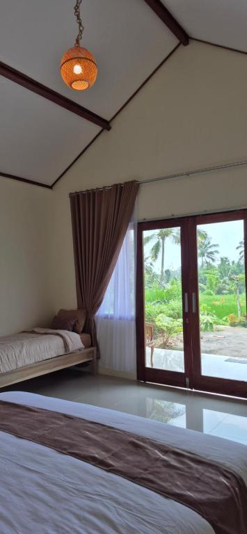 Postel nebo postele na pokoji v ubytování Rice Field inn - Lombok
