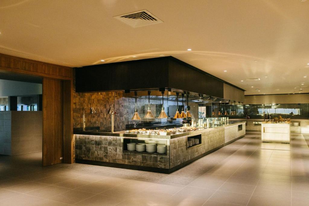 a restaurant with a buffet in the middle of a room at BANCAL HOTEL and SPA in San Sebastián de la Gomera