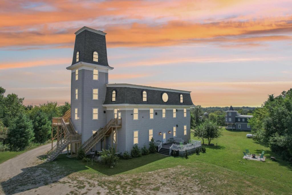an aerial view of a building with a tower at The Starlight Tower Manor, River, Arcades, Observatory, Theater in Fort Atkinson