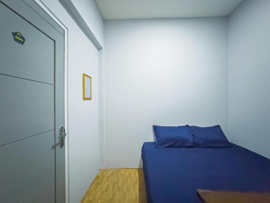 Postel nebo postele na pokoji v ubytování Beranda Istirahat Pluit