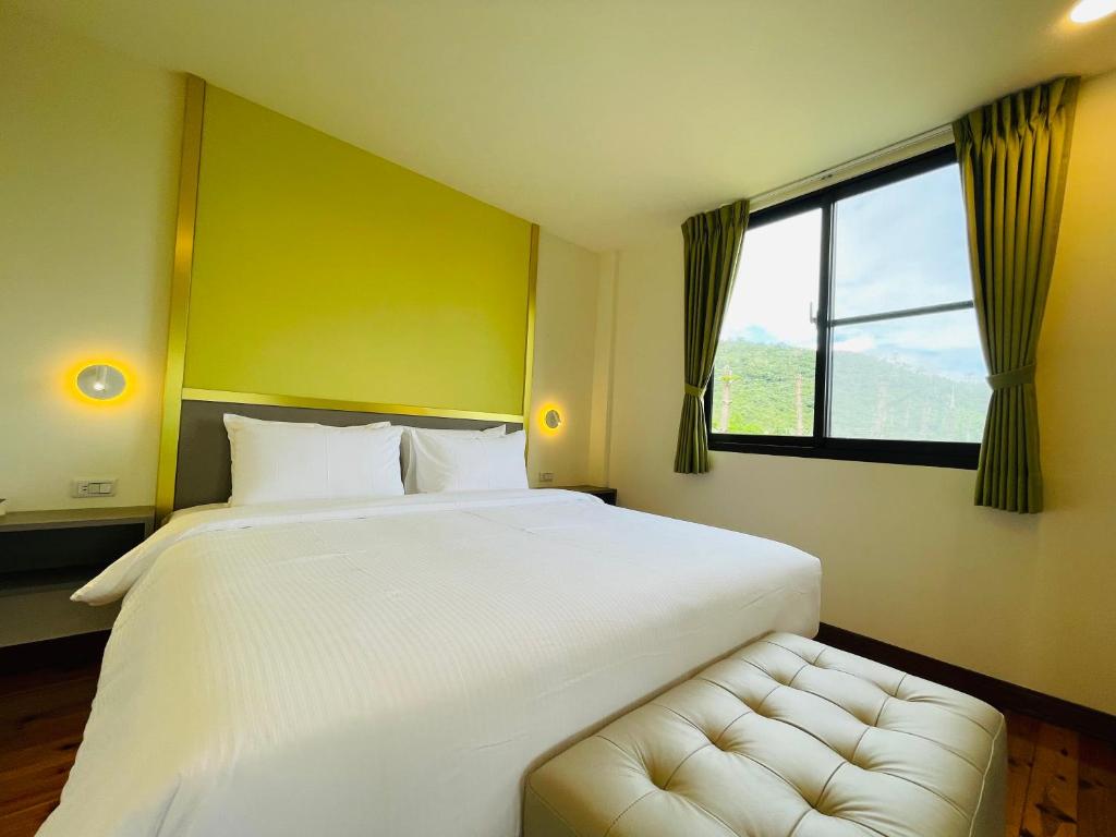 Postel nebo postele na pokoji v ubytování 大方來富莊園民宿DF Life Lodge
