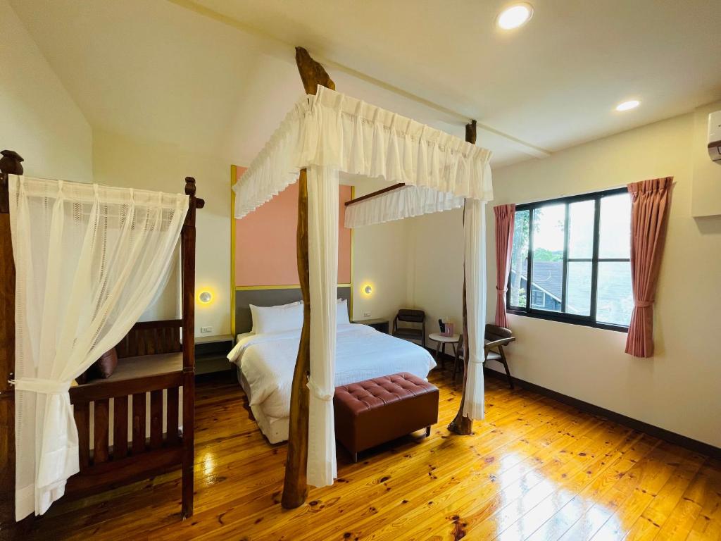 Postel nebo postele na pokoji v ubytování 大方來富莊園民宿DF Life Lodge