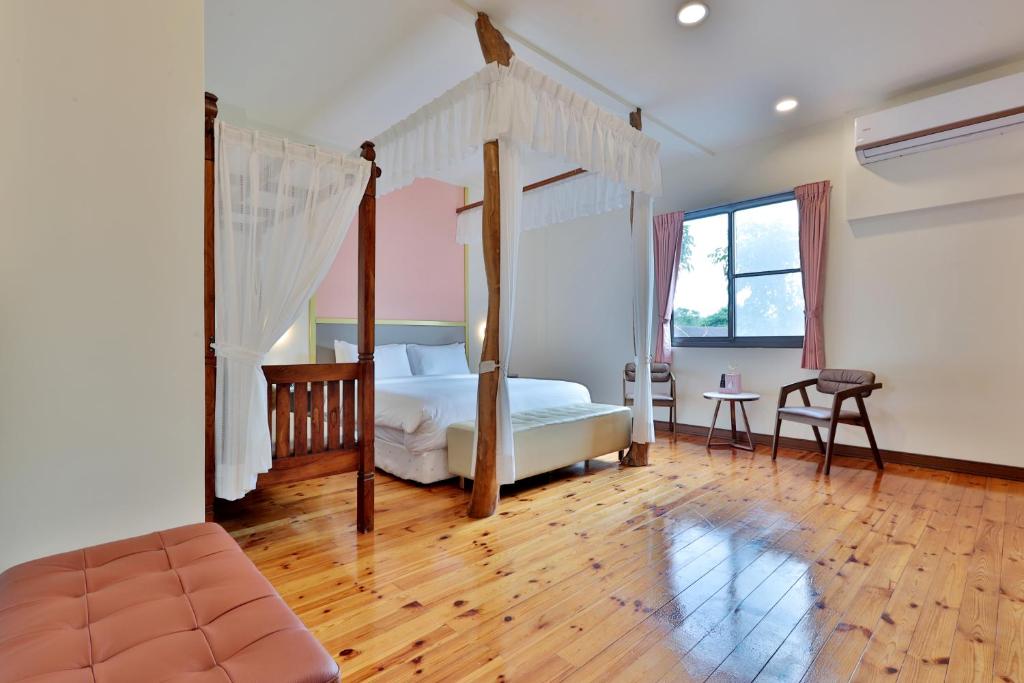 Postel nebo postele na pokoji v ubytování 大方來富莊園民宿DF Life Lodge
