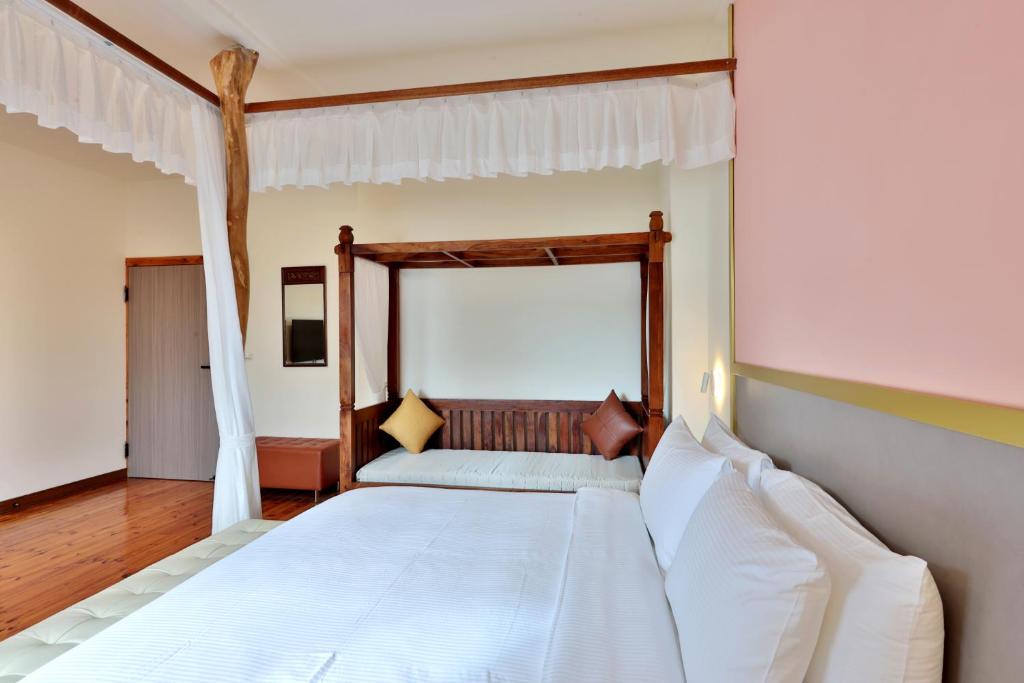 Postel nebo postele na pokoji v ubytování 大方來富莊園民宿DF Life Lodge