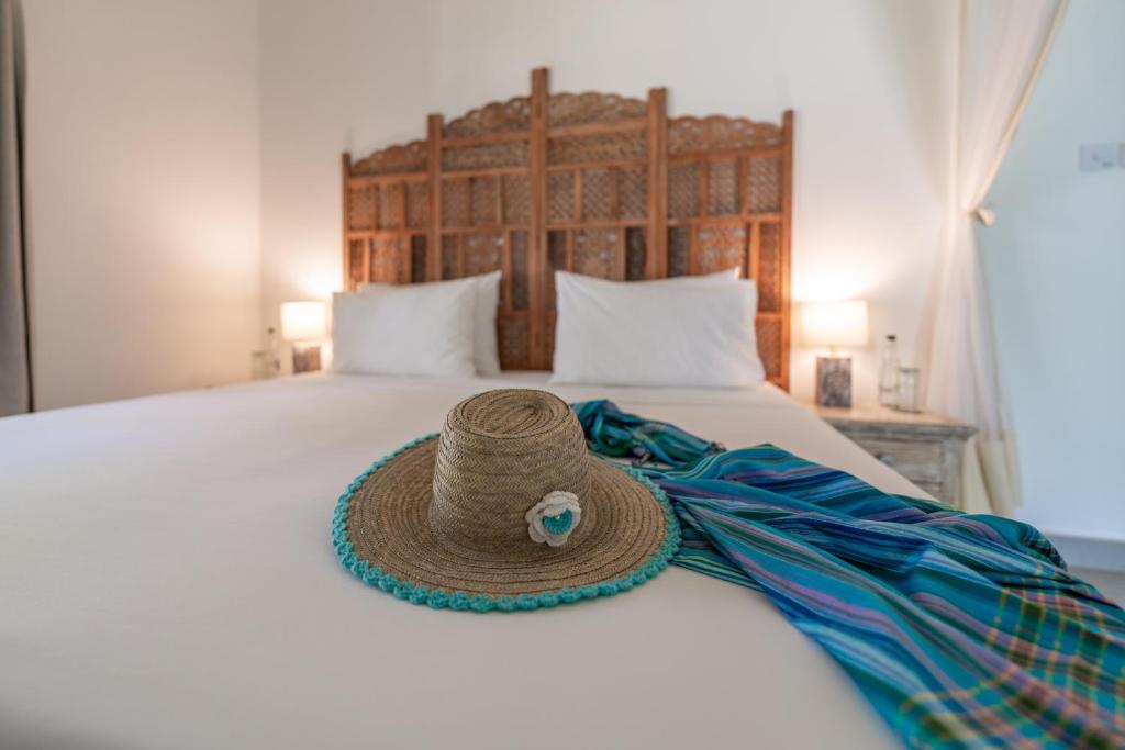 Postel nebo postele na pokoji v ubytování Nomad Beach Resort