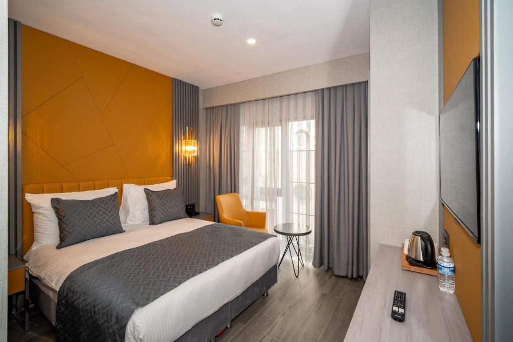 Postel nebo postele na pokoji v ubytování Icon Hotel Bomonti