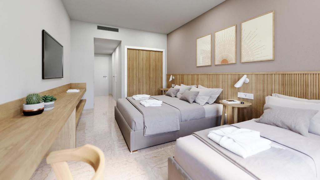 Postel nebo postele na pokoji v ubytování Roda Beach Resort & Spa