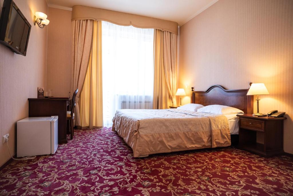 Postel nebo postele na pokoji v ubytování Solva Resort Medical & SPA