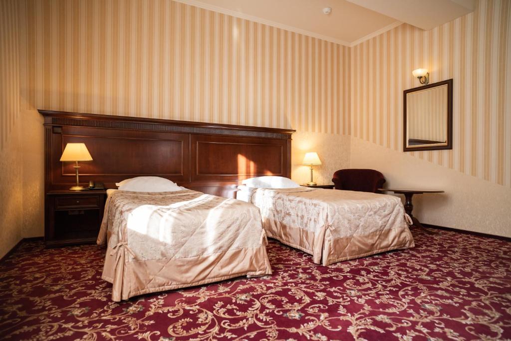 Postel nebo postele na pokoji v ubytování Solva Resort Medical & SPA