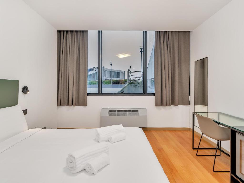 Postel nebo postele na pokoji v ubytování B&B HOTEL Alba