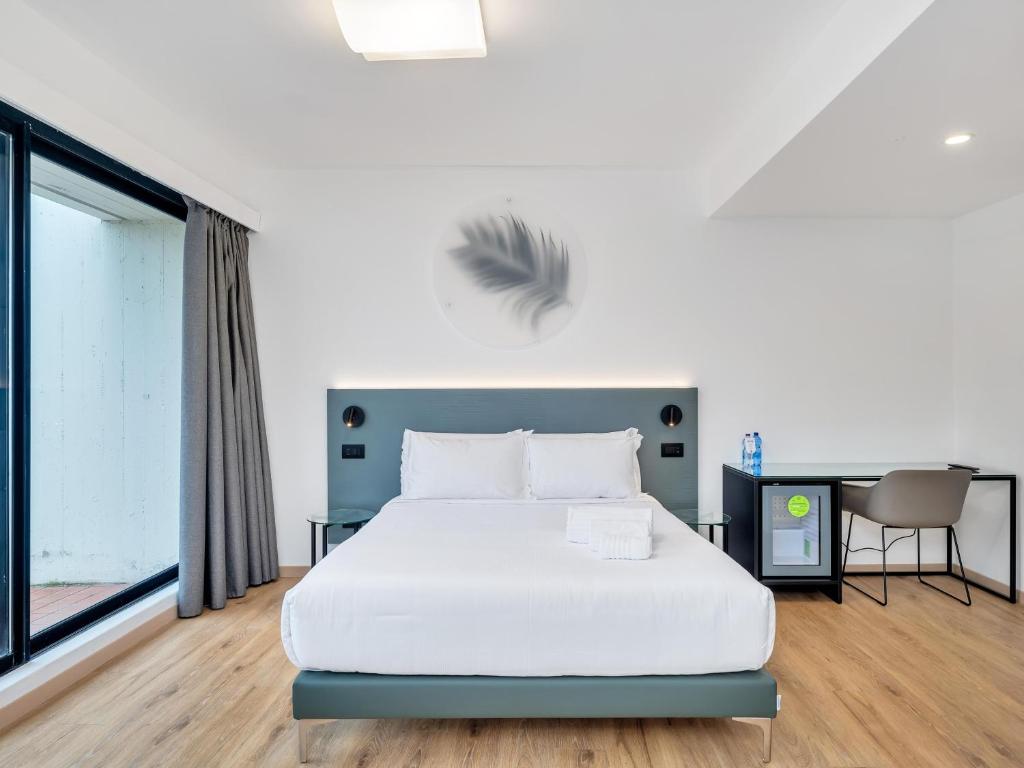 Postel nebo postele na pokoji v ubytování B&B HOTEL Alba