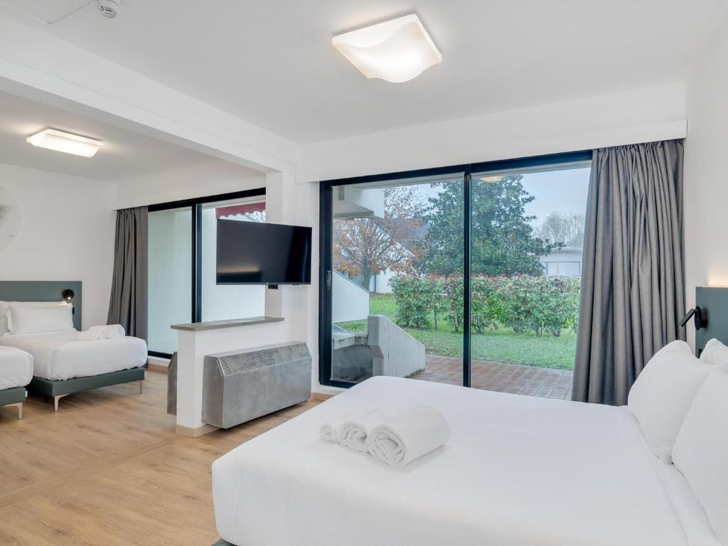 Postel nebo postele na pokoji v ubytování B&B HOTEL Alba