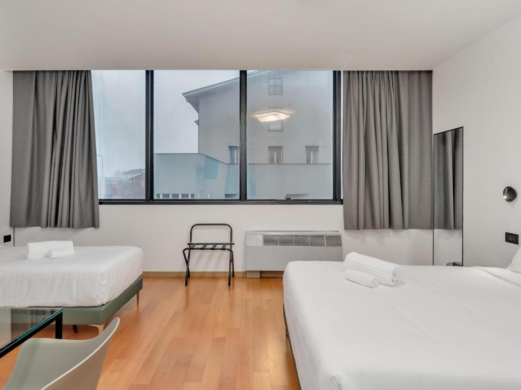 Postel nebo postele na pokoji v ubytování B&B HOTEL Alba