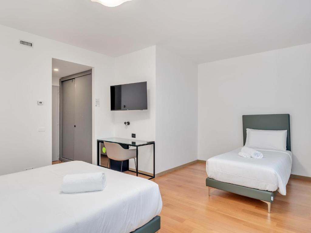Postel nebo postele na pokoji v ubytování B&B HOTEL Alba