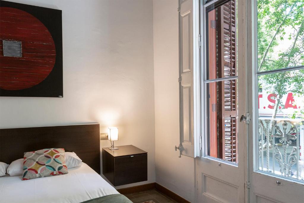 Posteľ alebo postele v izbe v ubytovaní AB Casanova Apartment