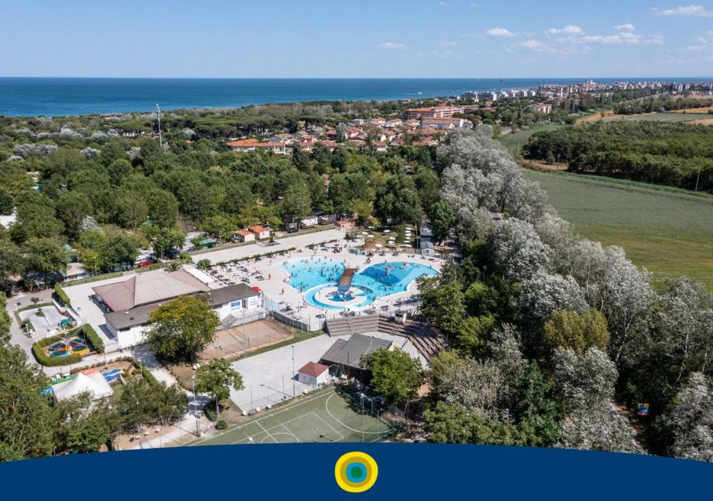 an aerial view of a resort with a swimming pool at Club del Sole Adriano Family Collection in Punta Marina