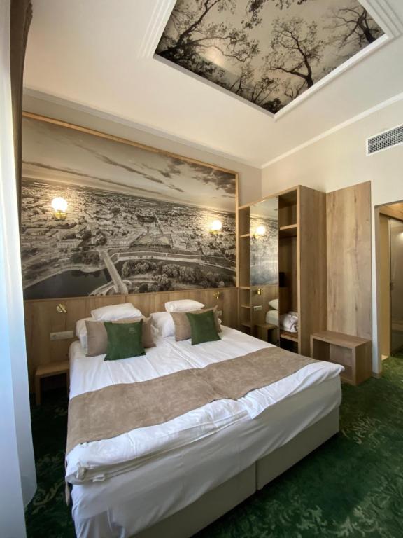 Postel nebo postele na pokoji v ubytování Duna Wellness Hotel