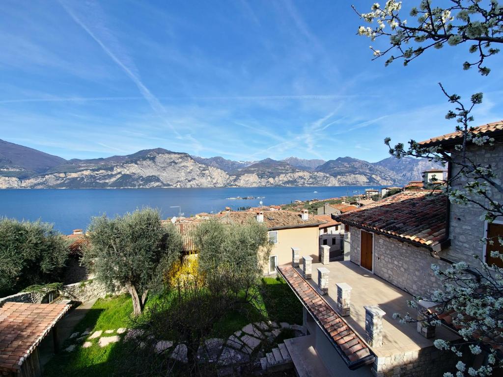 a view of the lake from the town at casa antico borgo - appartamento 1 in Assenza di Brenzone