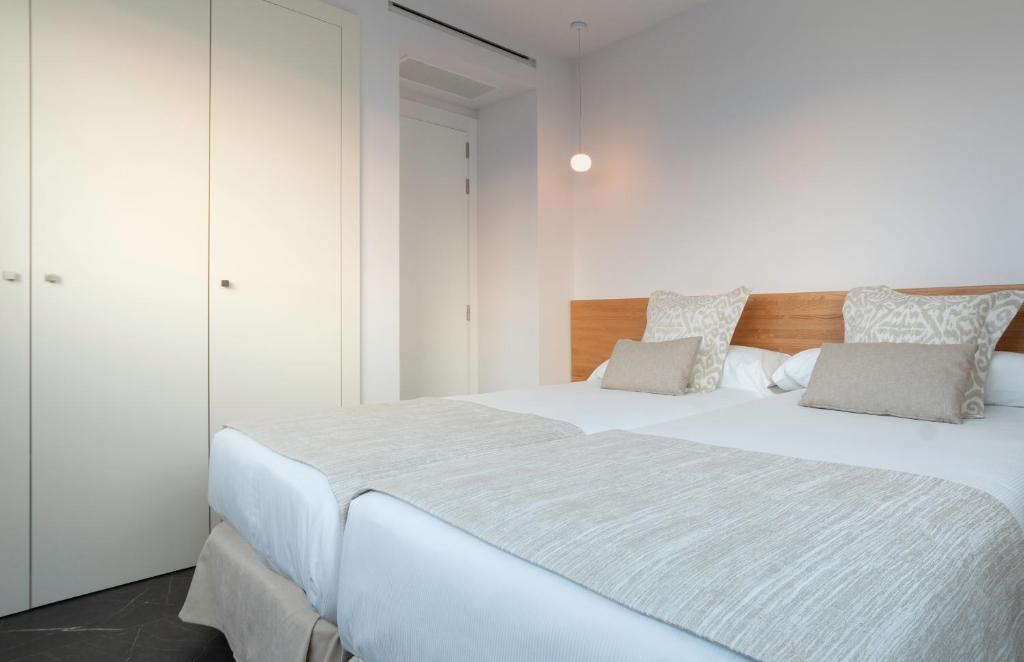 A bed or beds in a room at Pure Salt Residences