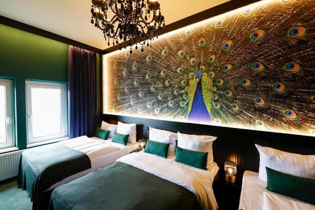 Postel nebo postele na pokoji v ubytování Sleephotels Casino