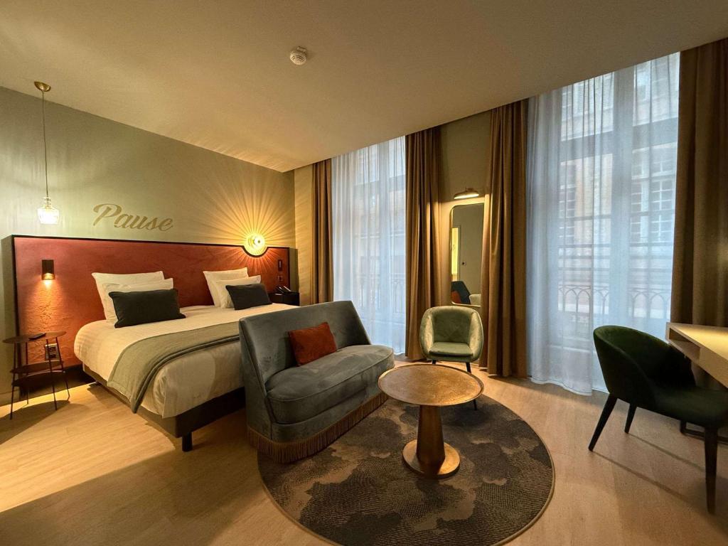 Postel nebo postele na pokoji v ubytování Hôtel Mercure Montauban