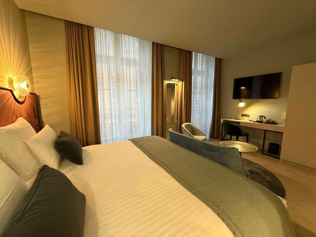 Postel nebo postele na pokoji v ubytování Hôtel Mercure Montauban