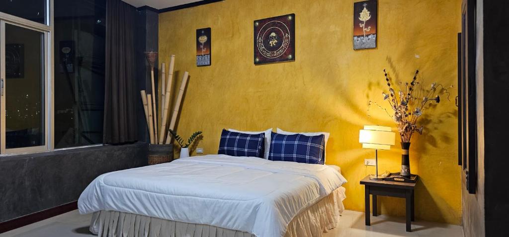 Postel nebo postele na pokoji v ubytování Velanon Phuket
