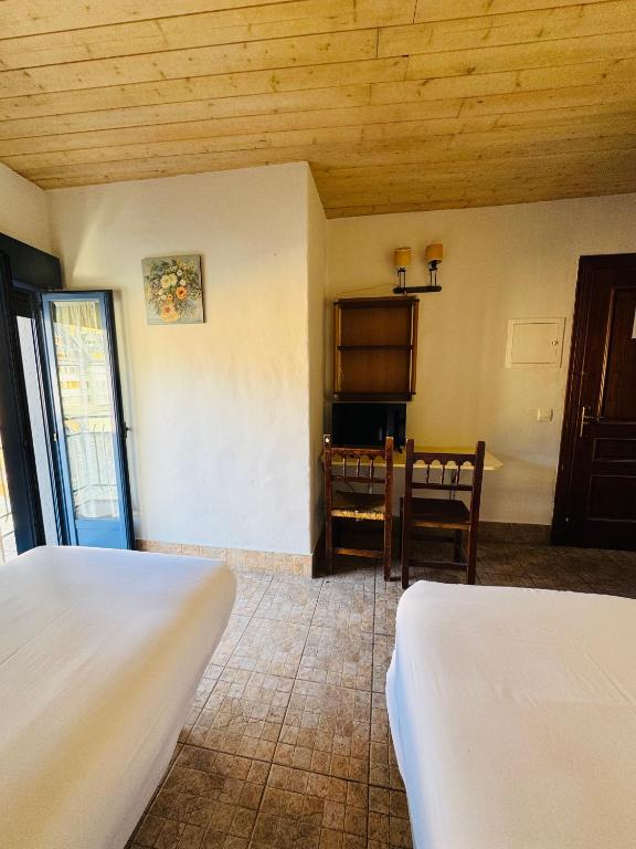 Postel nebo postele na pokoji v ubytování Hostal Nau Pradets