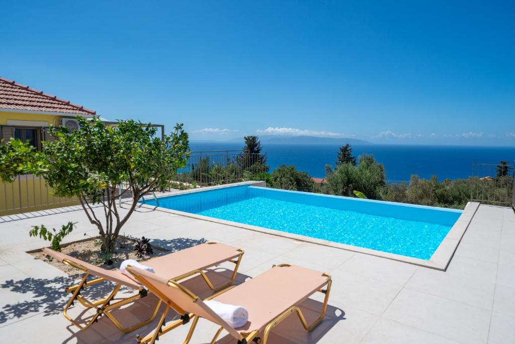 a villa with a swimming pool with a view at Villa Onera in Vlachata