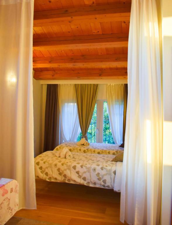Posteľ alebo postele v izbe v ubytovaní BeeHouse - La Casa delle Api Agriturismo