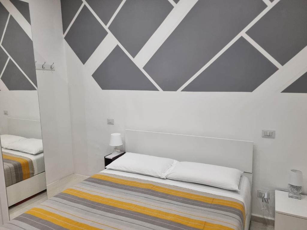 Postel nebo postele na pokoji v ubytování Locazione turistica adriatico