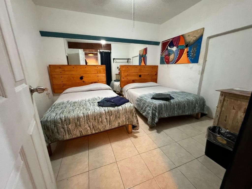 Postel nebo postele na pokoji v ubytování Casona Luciérnaga-Casa de Huéspedes