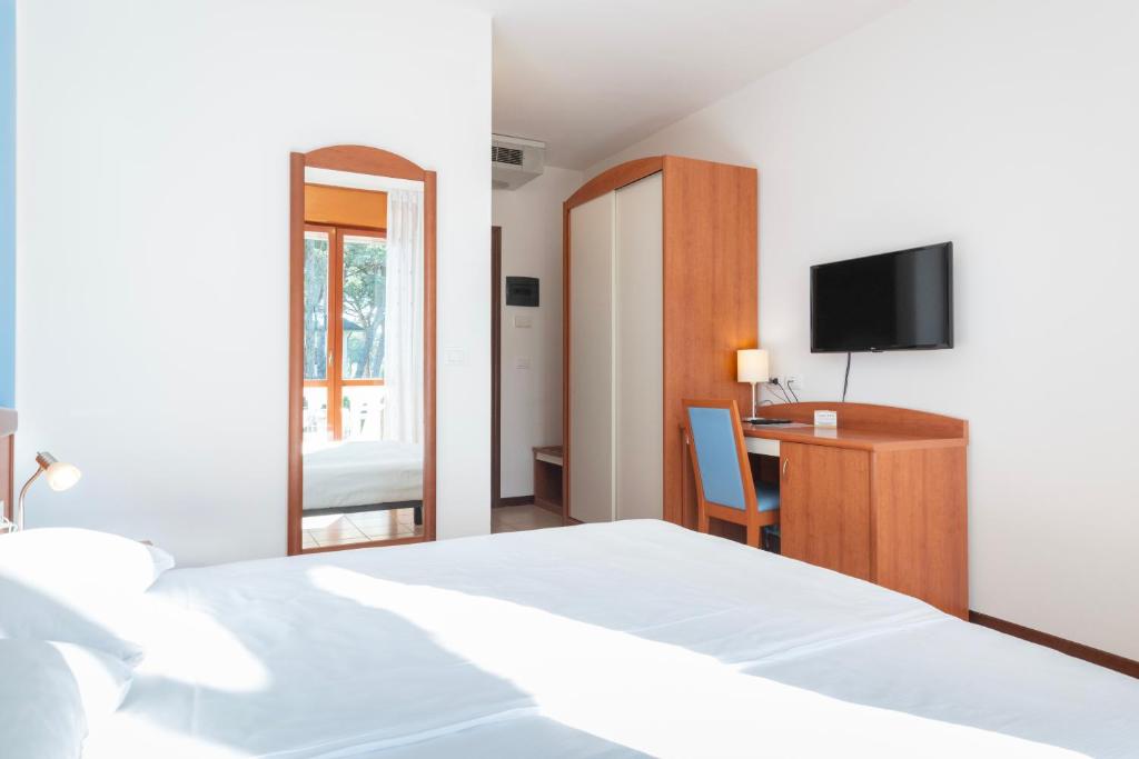 Postel nebo postele na pokoji v ubytování Hotel Caracas