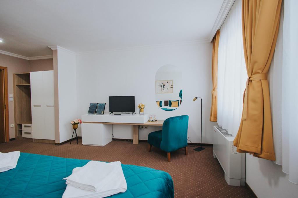 Postel nebo postele na pokoji v ubytování Hotel Brcko Gas Doboj