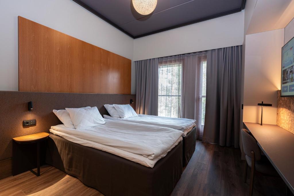 Кровать или кровати в номере Break Sokos Hotel Vuokatti