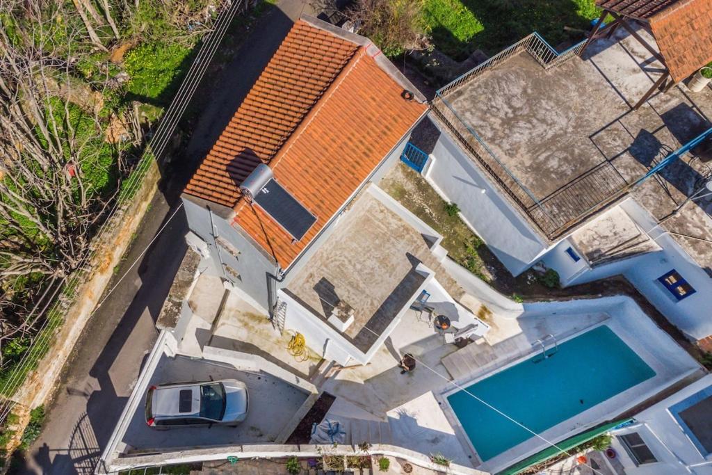 an overhead view of a house with a swimming pool at Armenous Green Dia's Mansion in Arménoi