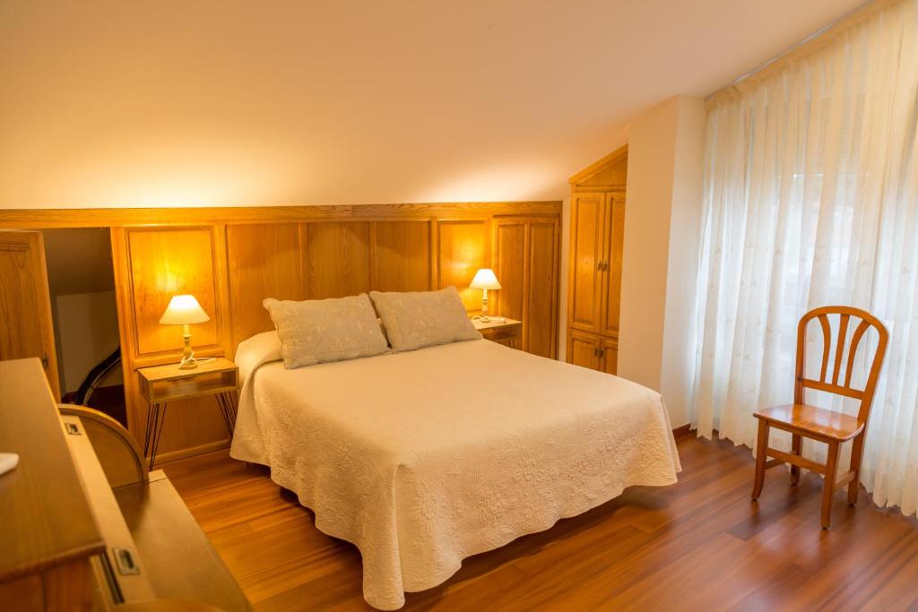 Posteľ alebo postele v izbe v ubytovaní Apartamentos Playa De Cóbreces