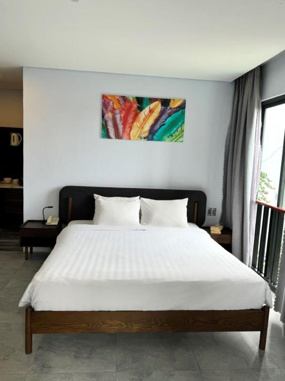 Postel nebo postele na pokoji v ubytování DOMA by HSuites Hotel & Apartment