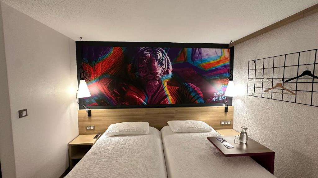 Postel nebo postele na pokoji v ubytování ibis styles Brive Ouest