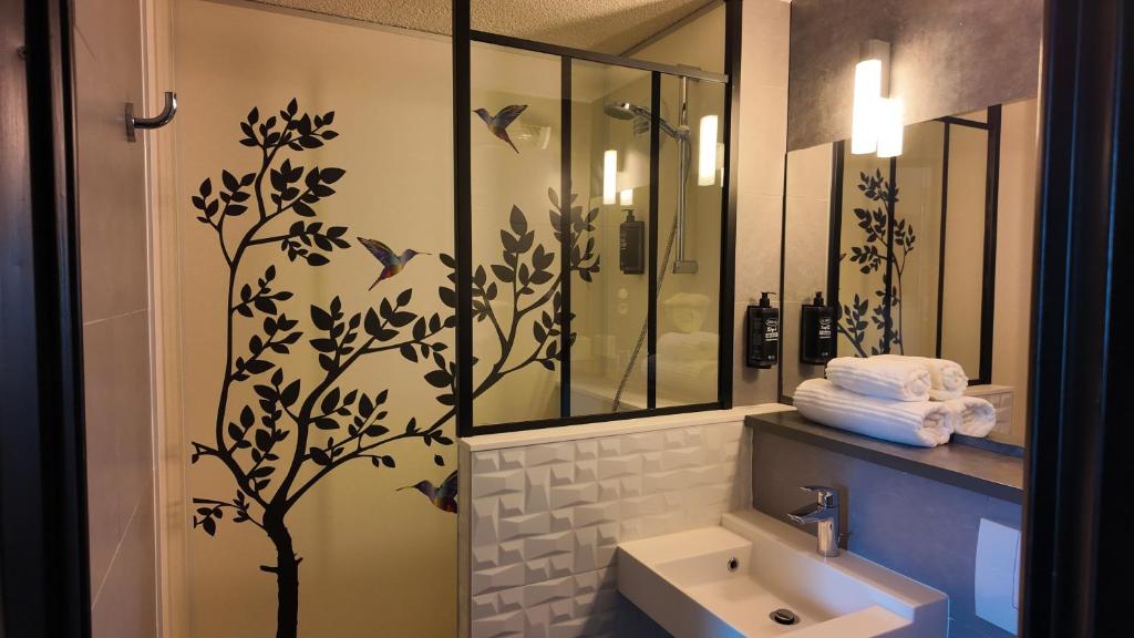 Koupelna v ubytování ibis styles Brive Ouest