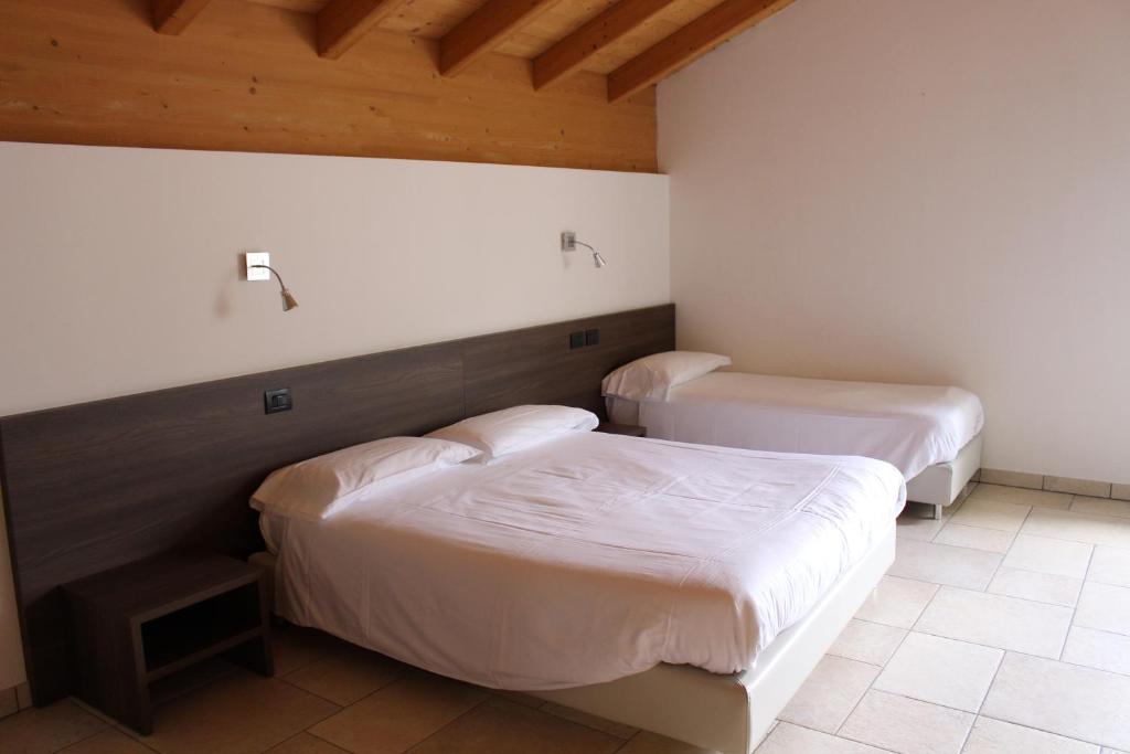 Postel nebo postele na pokoji v ubytování Ostello Guicciardi
