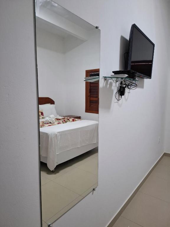 Postel nebo postele na pokoji v ubytování POUSADA TOCA DO LOBO