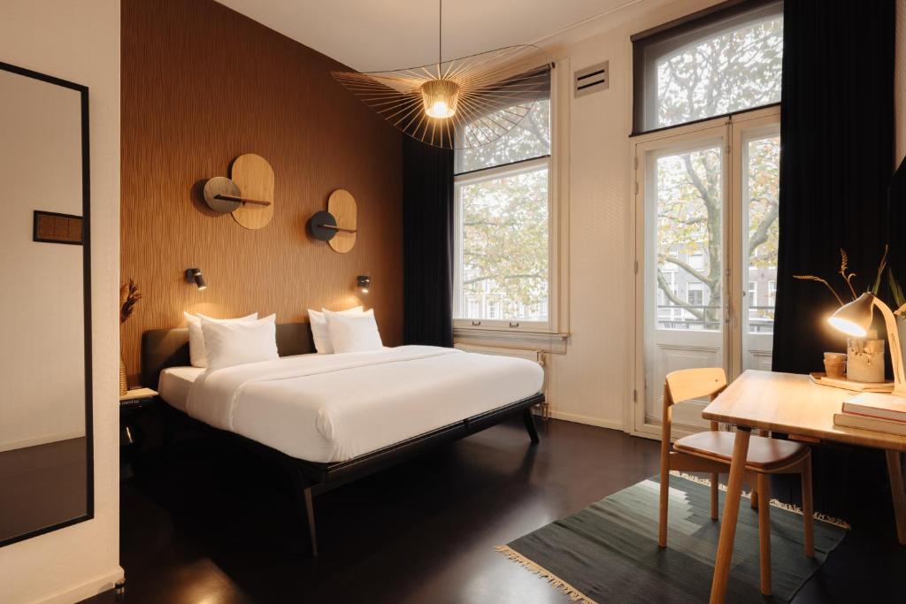 Postel nebo postele na pokoji v ubytování Hotel V Frederiksplein